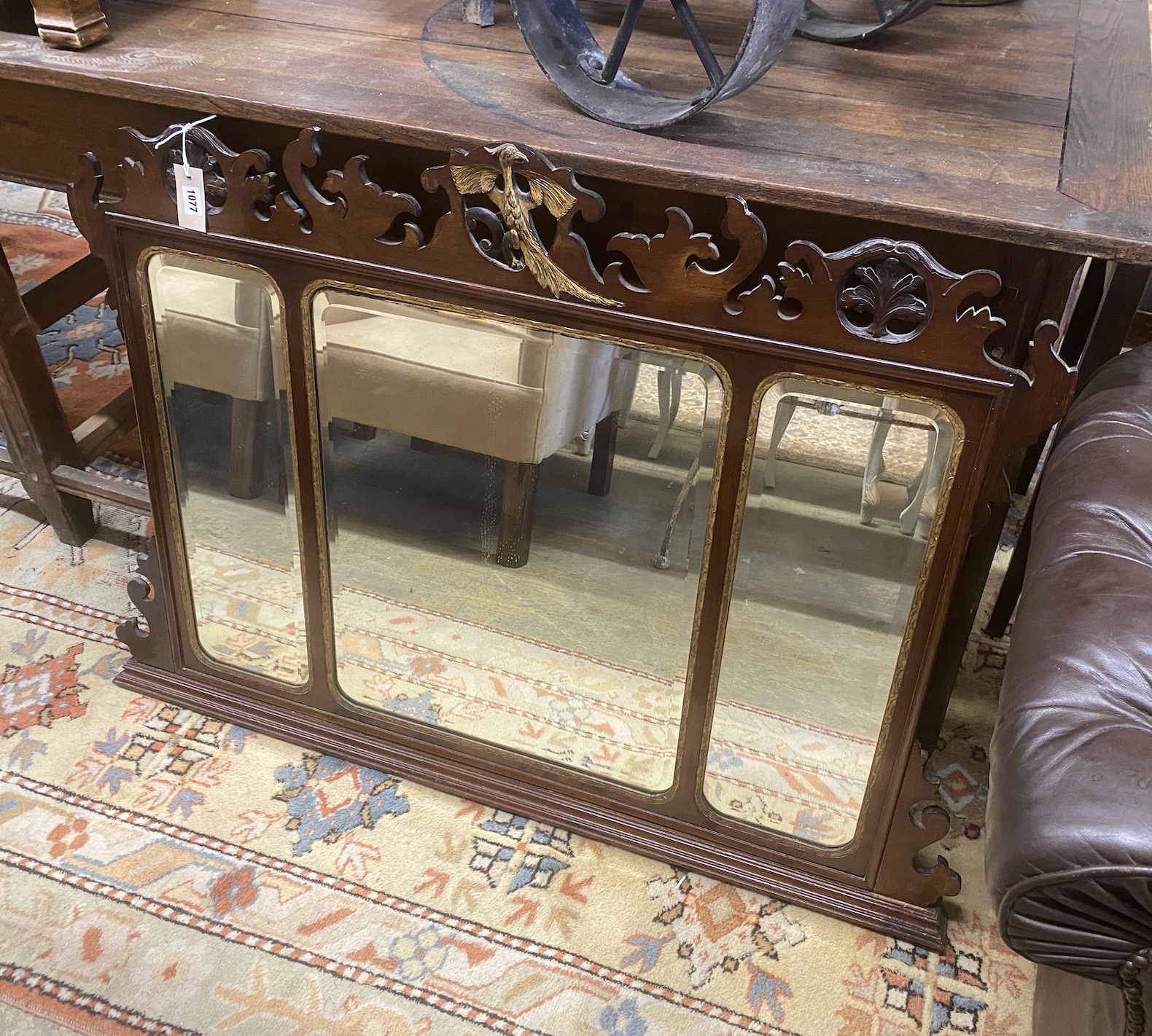 A George III style parcel gilt mahogany fret cut triple plate overmantel mirror, width 122cm, height 87cm